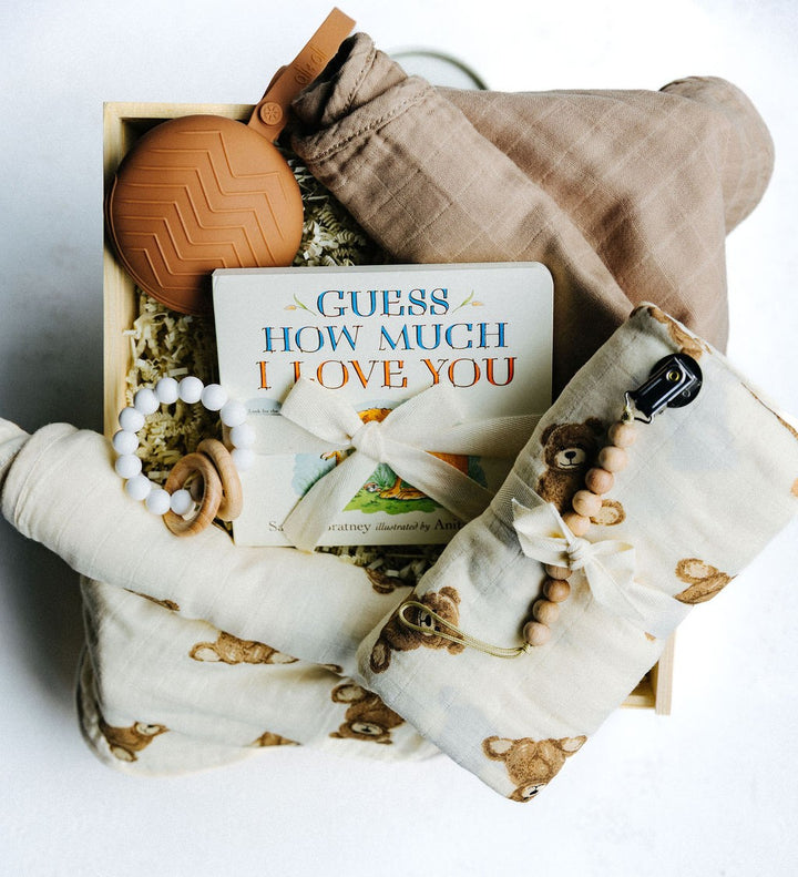 Welcome Little Bear Gift Box with swaddle, burp cloth, pacifier case, teether, and children’s book