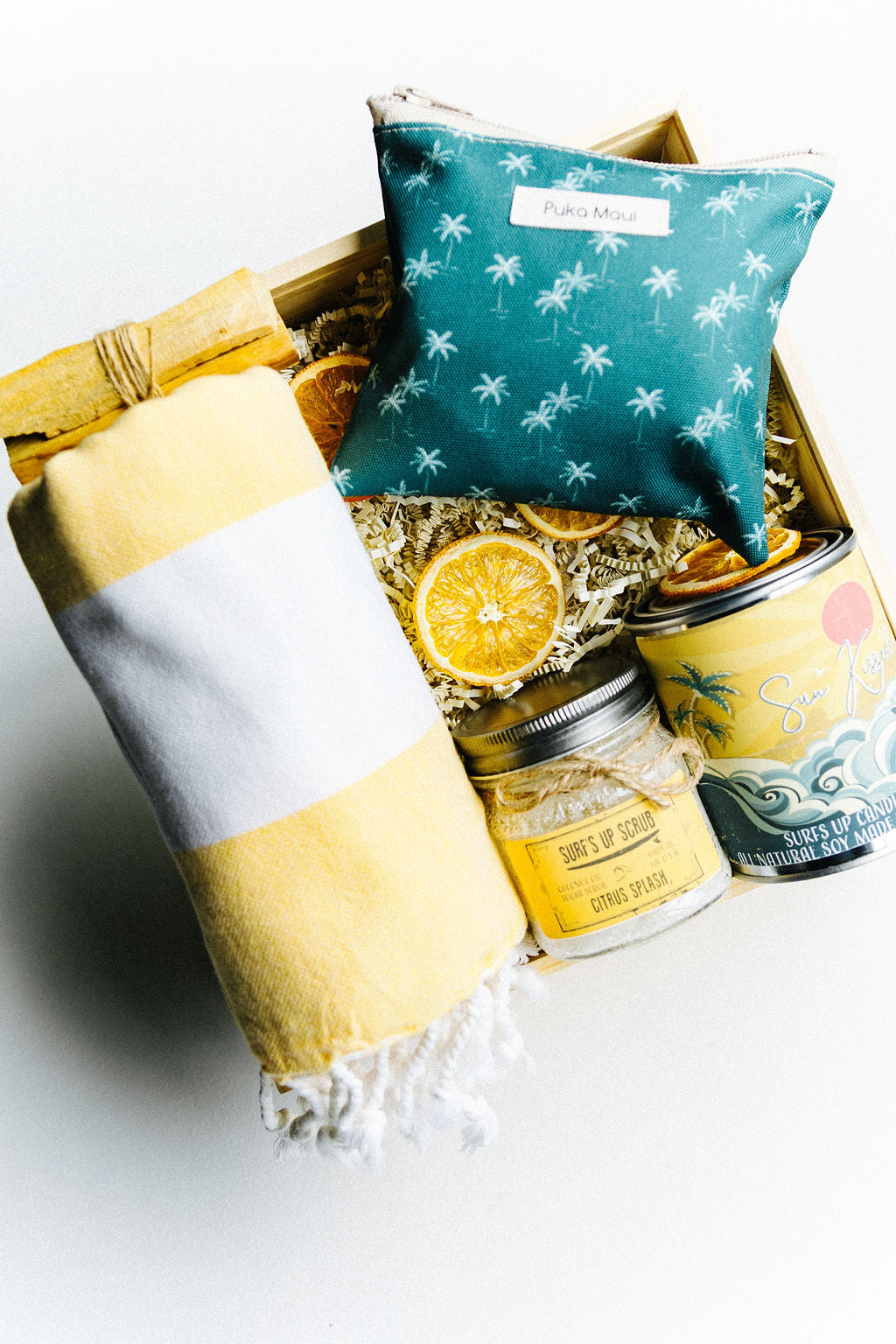 Jupiter Beach Box coastal gift set with striped Turkish towel, artisan green pouch, candle, and scrub