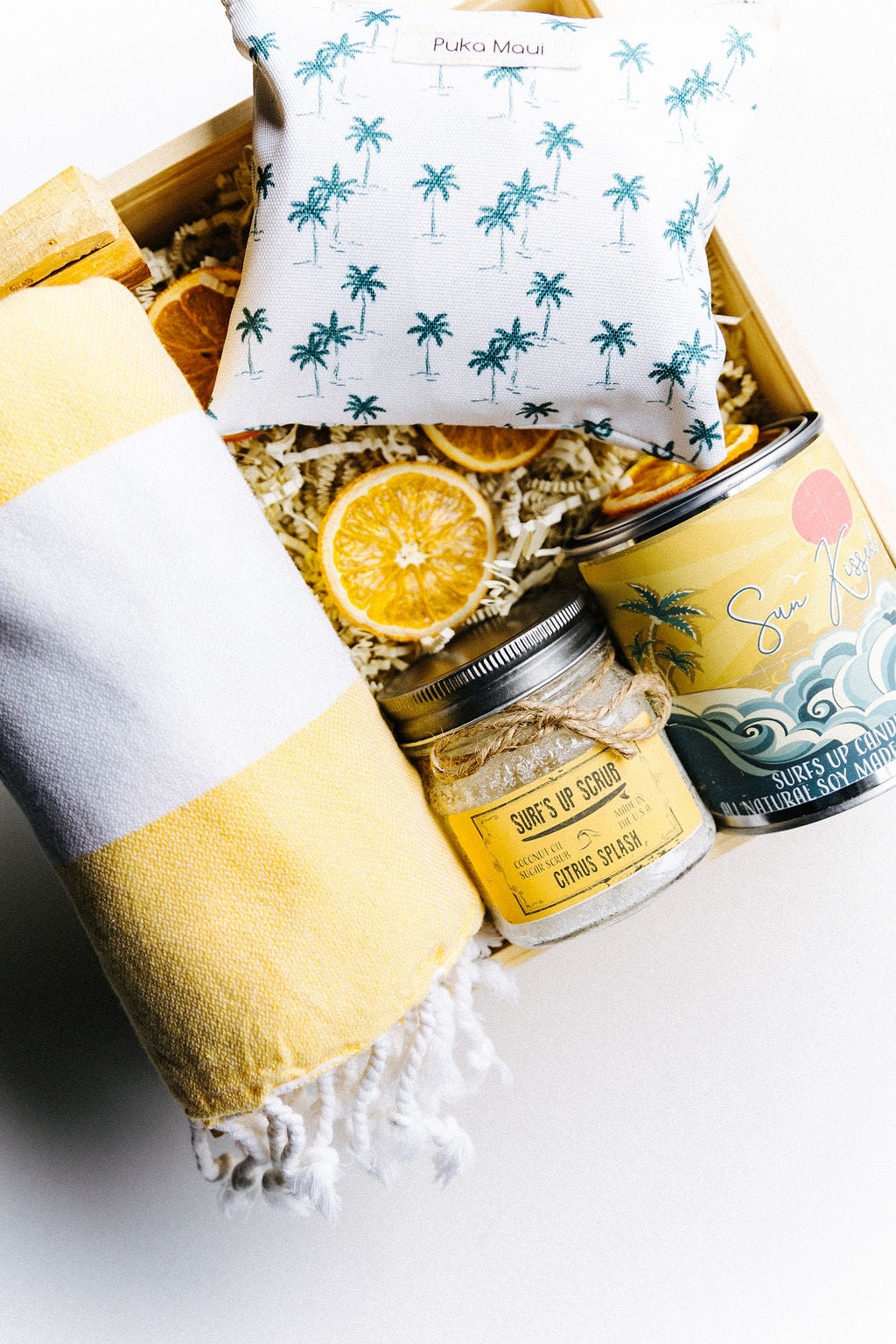 Jupiter Beach Box styled with dried orange slices and coastal artisan products including white pouch