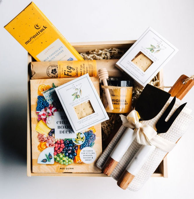 Luxury Grazing Board Gift Box with cheese board, knives, honey, fig salami, crackers, and chocolate