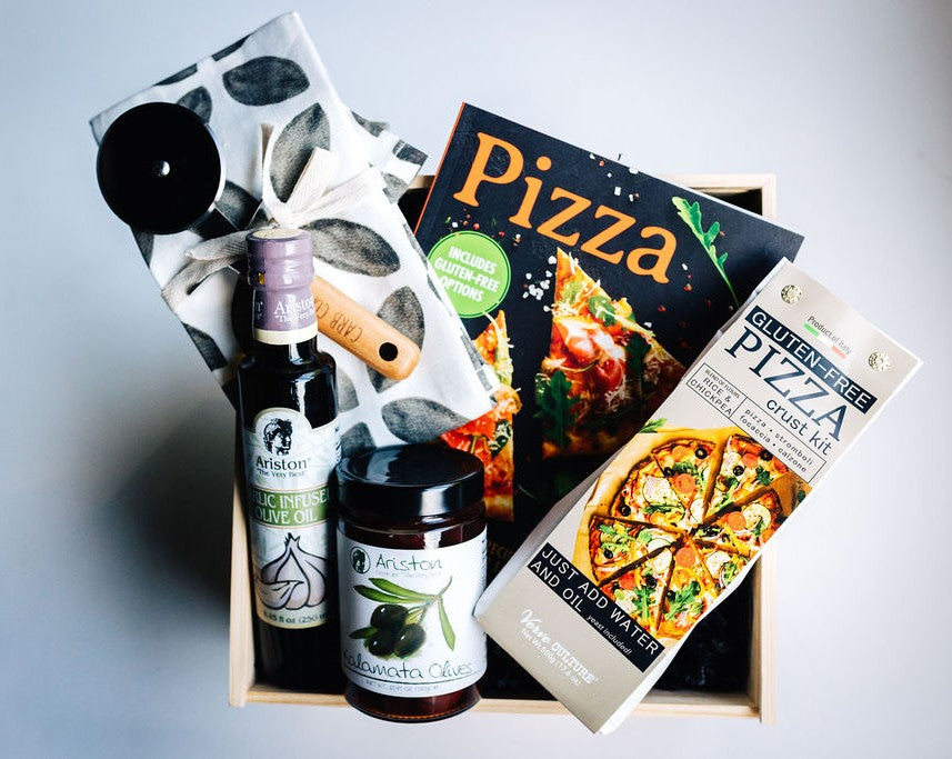Gluten-free pizza night gift box with cookbook, garlic olive oil, Kalamata olives, tea towel, pizza cutter, and Italian gluten-free crust kit