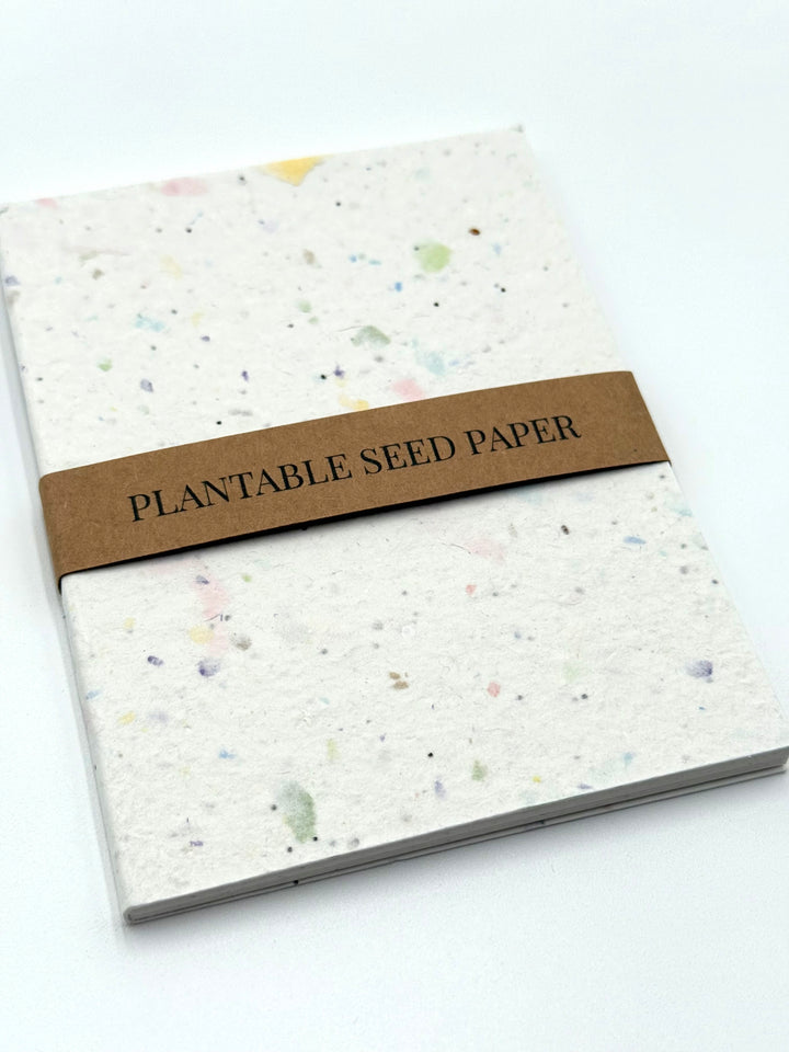 Eco-friendly seed paper journal with kraft paper belly band, ready to plant after use