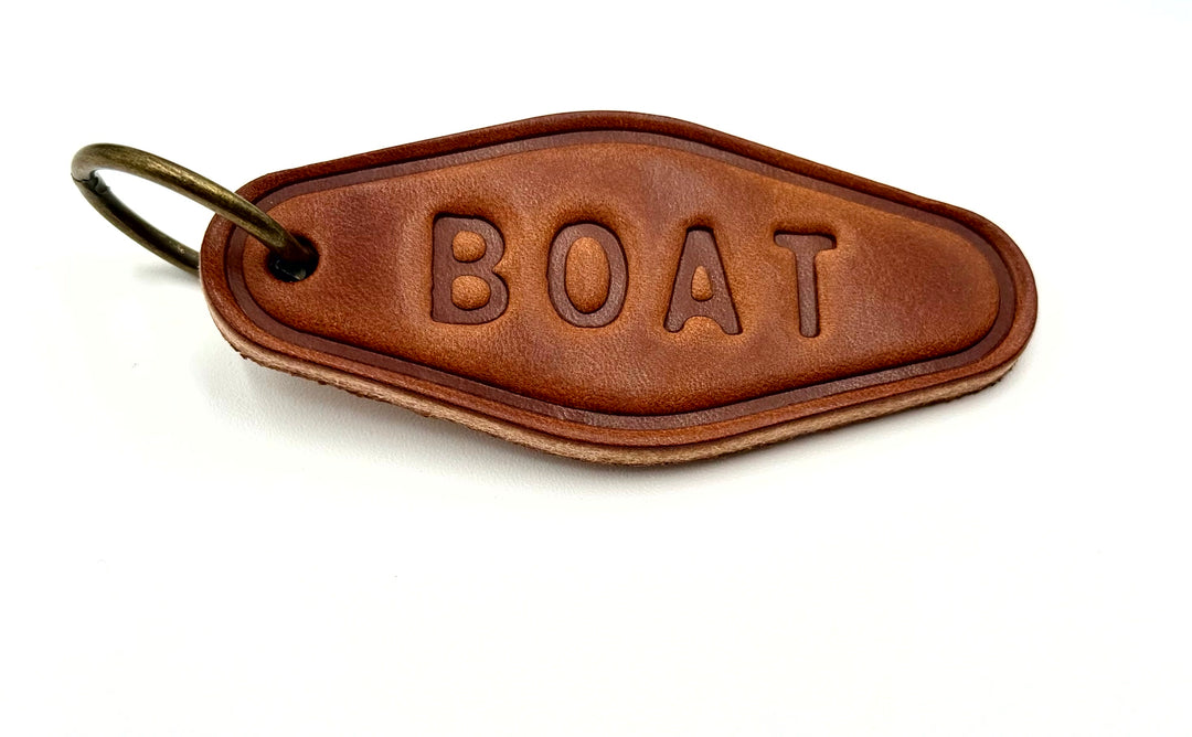 Brown leather BOAT keychain with brass ring – nautical keychain included in Salty Sailor Gift Box.