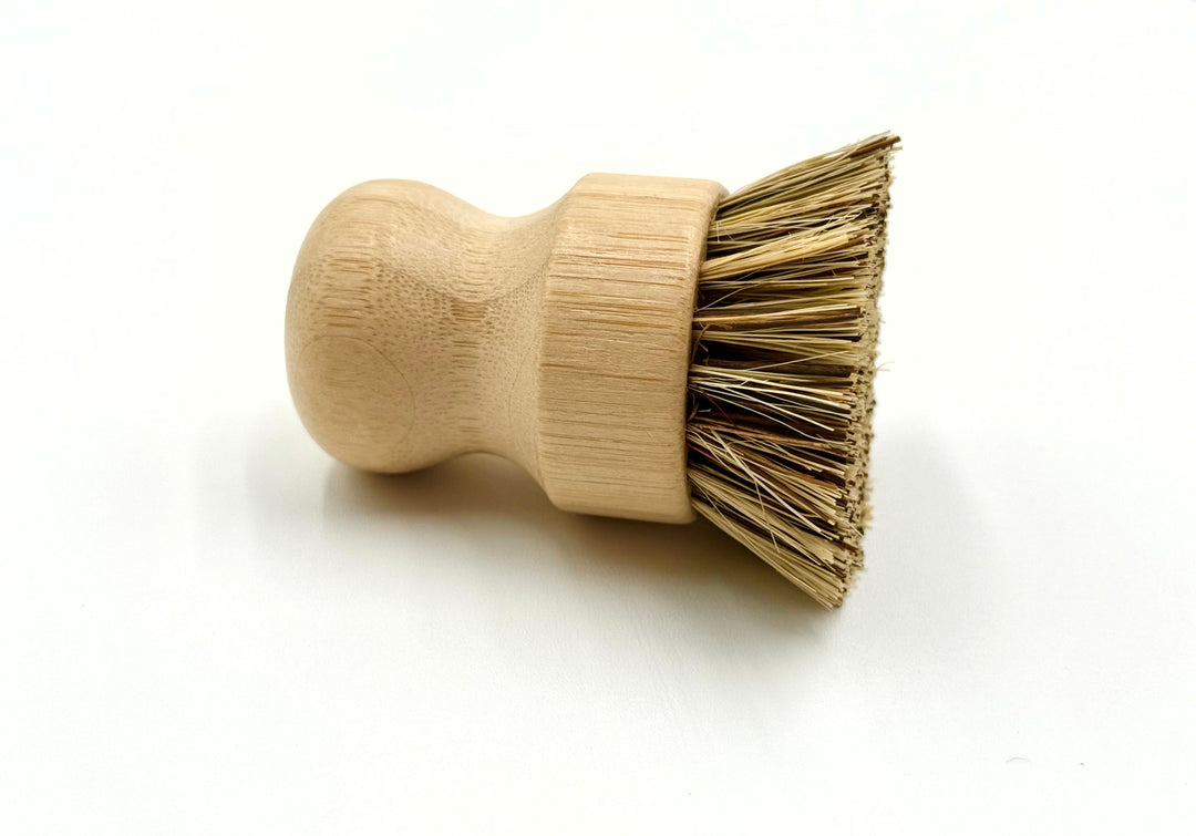 Wooden brush with bristle head on a white background