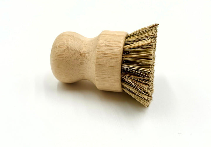 Wooden brush with bristle head on a white background